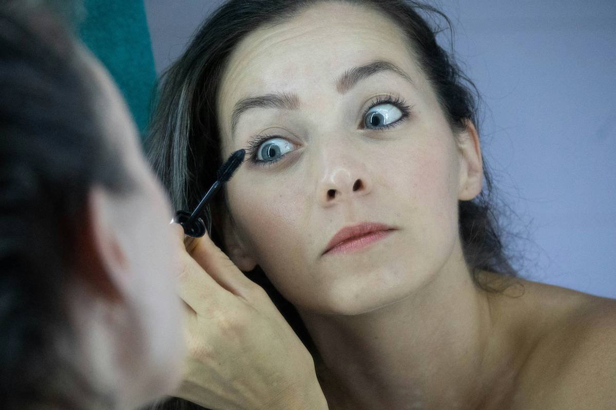 Side-by-side comparison of a cheap drugstore eyelash curler vs. a professional eyelash curler showing pad alignment, spring mechanism, and curvature fit on an eye model